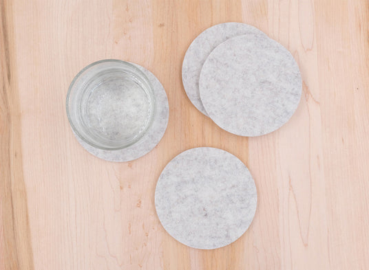 Light gray Woolsters on table with water glass