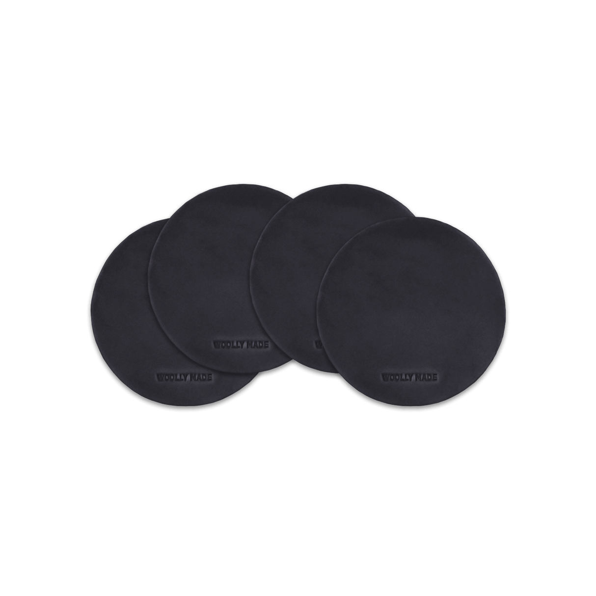 Black leather round coaster set with hand-pressed Woolly Made logo spread out.