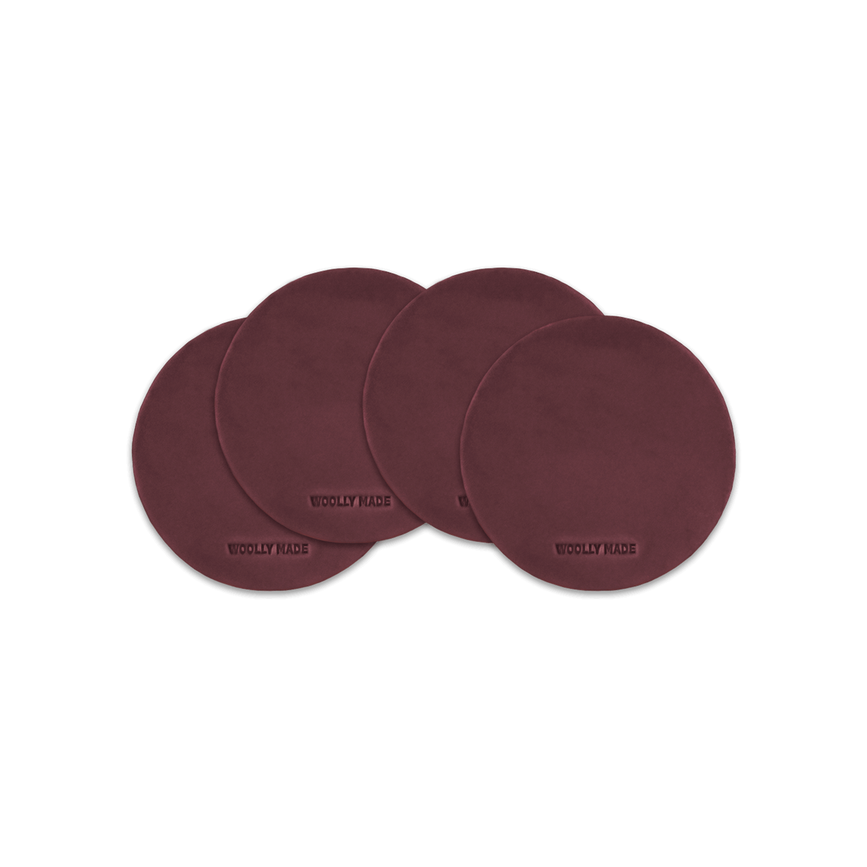 Burgundy leather round coaster set with hand-pressed Woolly Made logo spread out.