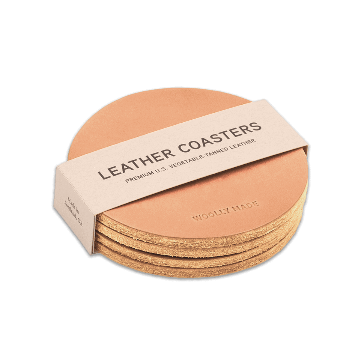 Natural leather round coaster set with hand-pressed Woolly Made logo stacked.