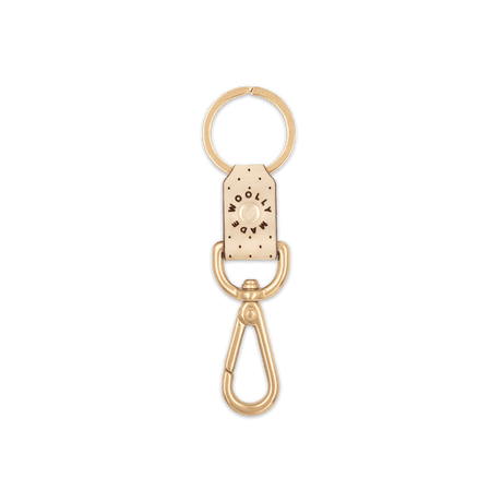 Tusk leather Swivel Keychain, decorative perforation, etched Woolly Made logo, brass hardware.