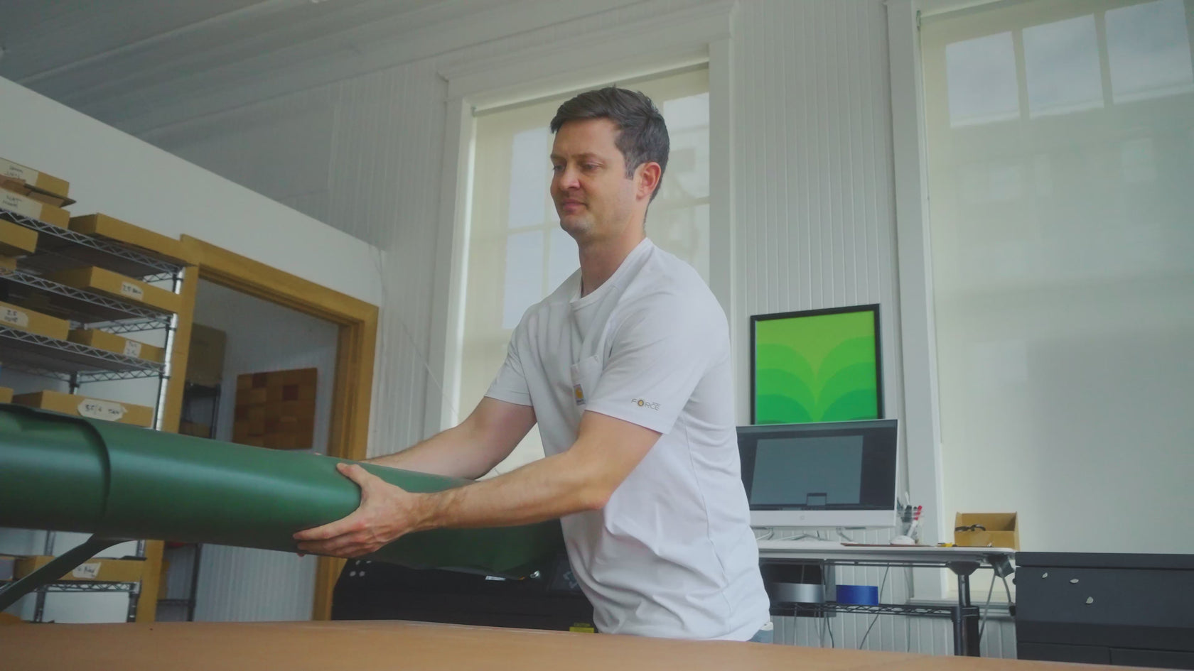 Co-founder Jake making a green Contour Texture Half Wallet