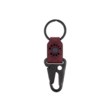 Burgundy leather Clip Keychain, etched Woolly Made logo, decorative perforation, and black hardware.