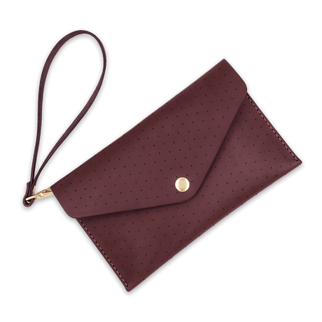 Burgundy leather Clutch, decorative perforation, attached matching wrist strap, and brass hardware.