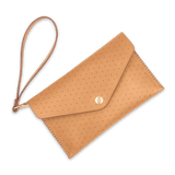 Tan leather Clutch with decorative perforation, attached matching wrist strap, and brass hardware.