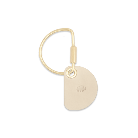 Tusk Crescent Keychain with brass hardware.