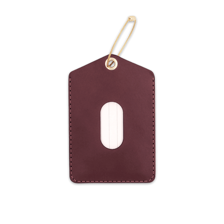 Burgundy leather Luggage Tag with blank info card and window, and brass hardware.