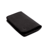 Black glazed leather Flip Wallet 3/4 angle view with hand-pressed Woolly Made logo.