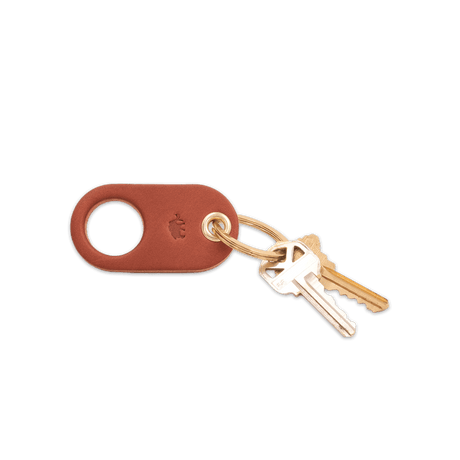 Brown leather Grip Keychain with hand-pressed Woolly Made logo, brass hardware, and keys.