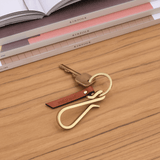Hairpin Keychain in brown in lifestyle scene.