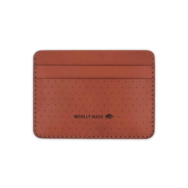 Brown leather Half Wallet with decorative perforation and etched Woolly Made logo.