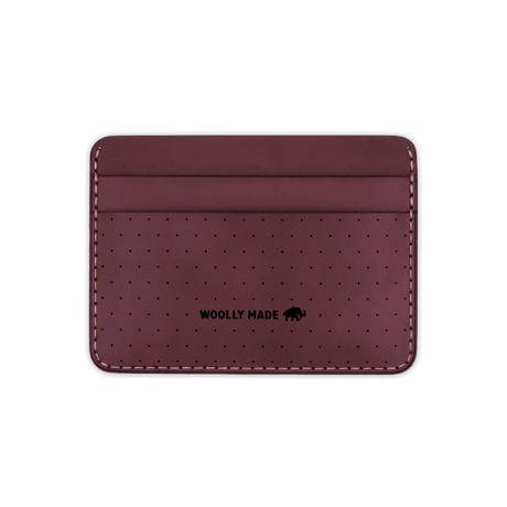 Burgundy leather Half Wallet with decorative perforation and etched Woolly Made logo.