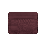 Burgundy leather Texture with hand-pressed design and Woolly Made logo.