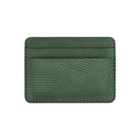 Green leather Texture with hand-pressed design and Woolly Made logo.