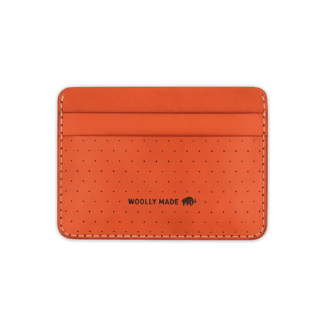 Orange leather Half Wallet with decorative perforation and etched Woolly Made logo.