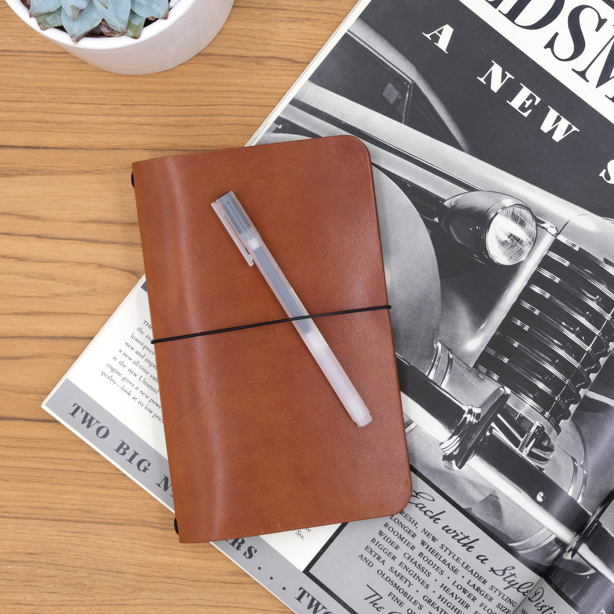 Woolly Made Journal in Brown on a vintage magazine.