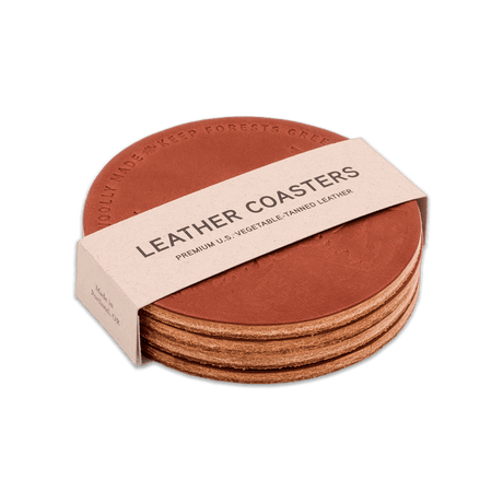 Keep Forests Green brown leather round coaster, stacked, hand-pressed design, Woolly Made logo.