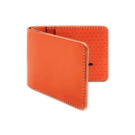 Orange leather, decorative perforation and etched Woolly Made logo.