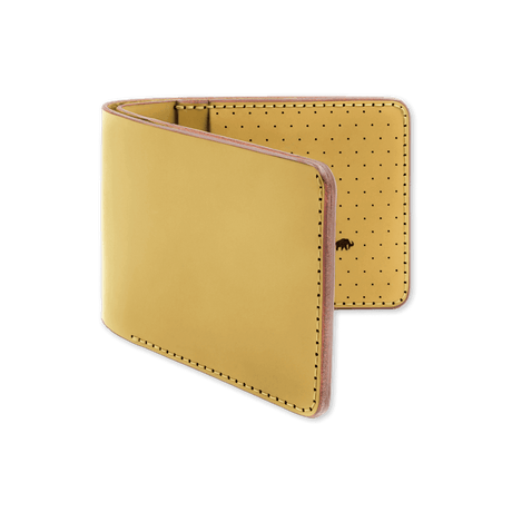 Yellow leather, decorative perforation and etched Woolly Made logo.