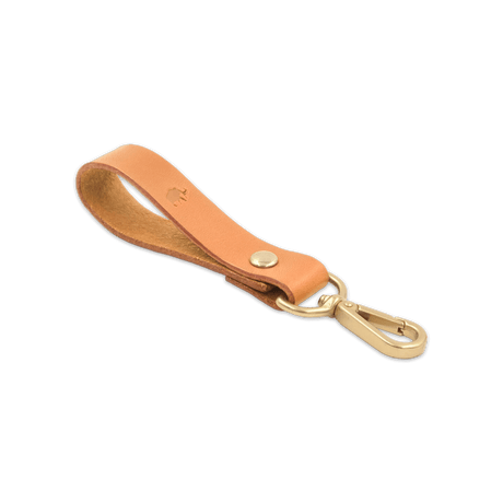 Tan leather Loop Keychain 3/4 angle view with brass hardware and hand-pressed Woolly Made logo.