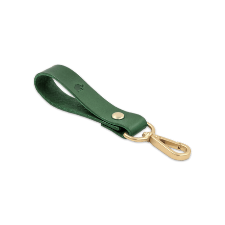 Green leather Loop Keychain 3/4 angle view with brass hardware and hand-pressed Woolly Made logo.