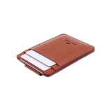 Brown leather Money Clip 3/4 angle, decorative perforation, etched Woolly Made logo, white cards.