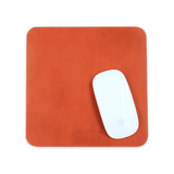 Orange leather Mouse Pad with Apple Mouse.