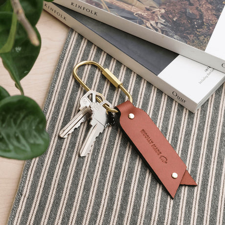 Oval Keychain in Brown leather in a lifestyle scene.