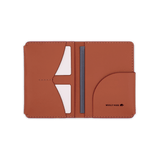 Brown leather Passport Wallet open view with etched Woolly Made logo, white cards, and passport.