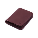 Burgundy leather Portrait Wallet 3/4 angle view with hand-pressed Woolly Made logo.