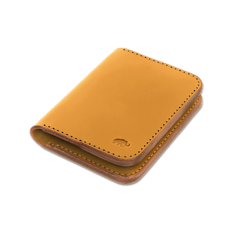 Gold leather Portrait Wallet 3/4 angle view with hand-pressed Woolly Made logo.