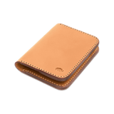 Tan leather Portrait Wallet 3/4 angle view with hand-pressed Woolly Made logo.