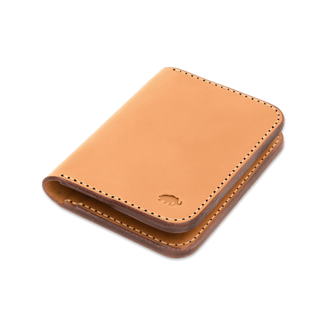 Tan leather Portrait Wallet 3/4 angle view with hand-pressed Woolly Made logo.