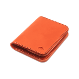 Orange leather Portrait Wallet 3/4 angle view with hand-pressed Woolly Made logo.