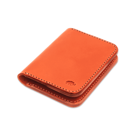 Orange leather Portrait Wallet 3/4 angle view with hand-pressed Woolly Made logo.