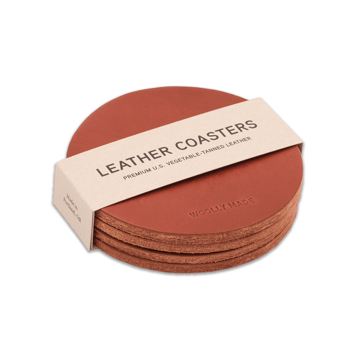 Brown leather round coaster set with hand-pressed Woolly Made logo stacked.