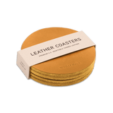 Gold leather round coaster set with hand-pressed Woolly Made logo stacked.