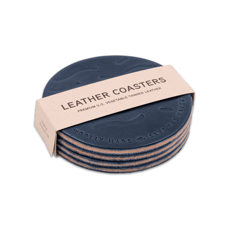 Save the Waves blue leather round coasters, stacked, hand-pressed wave design, Woolly Made logo.