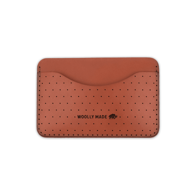 Brown leather Slim Wallet with decorative perforation and etched Woolly Made logo.