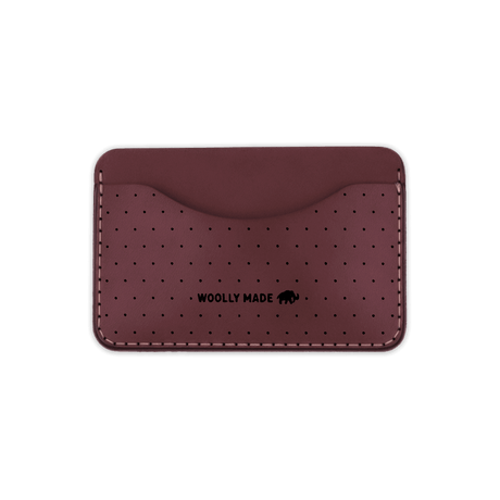 Burgundy leather Slim Wallet with decorative perforation and etched Woolly Made logo.