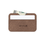 Plant leather Slim Wallet, decorative perforation, white card, folded bill, etched Woolly Made logo.