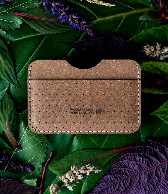 Plant Slim Wallet on a bed of leaves and flowers