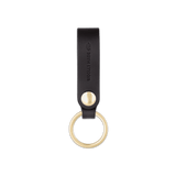 Black leather Snap Keychain  front view with brass keyring and hand-pressed Woolly Made logo.