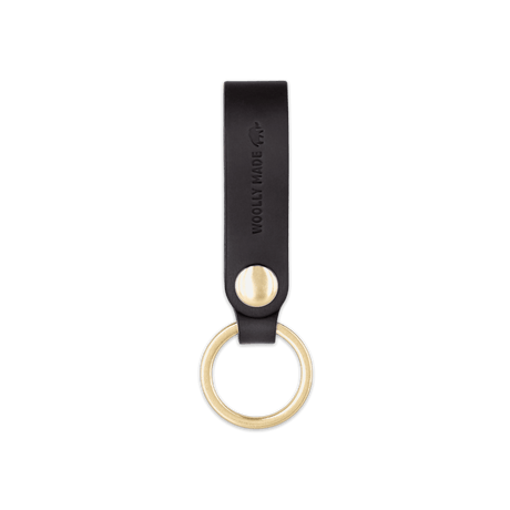 Black leather Snap Keychain  front view with brass keyring and hand-pressed Woolly Made logo.