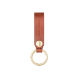 Brown leather Snap Keychain front view with brass keyring and hand-pressed Woolly Made logo.
