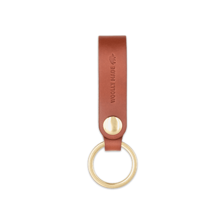Brown leather Snap Keychain front view with brass keyring and hand-pressed Woolly Made logo.