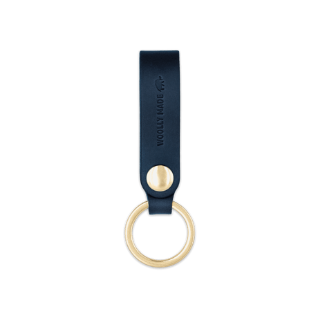 Navy leather Snap Keychain  front view with brass keyring and hand-pressed Woolly Made logo.