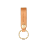 Tan leather Snap Keychain  front view with brass keyring and hand-pressed Woolly Made logo.