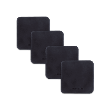 Black leather square coaster set with hand-pressed Woolly Made logo spread out.