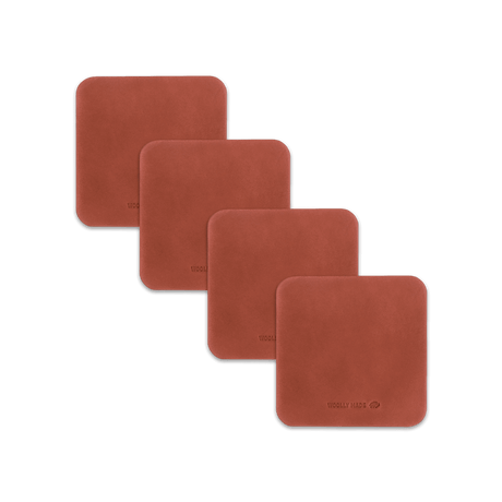 Brown leather square coaster set with hand-pressed Woolly Made logo spread out.